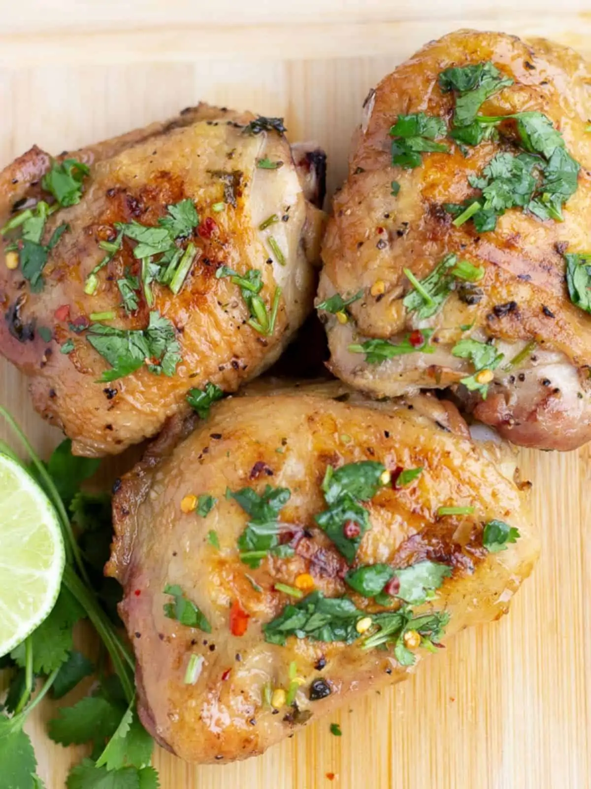 Overhead view of cilantro lime chicken pieces.