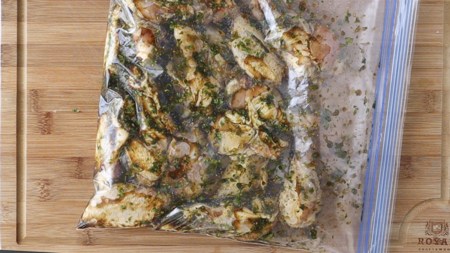 Chicken in a zip top bag with marinade.