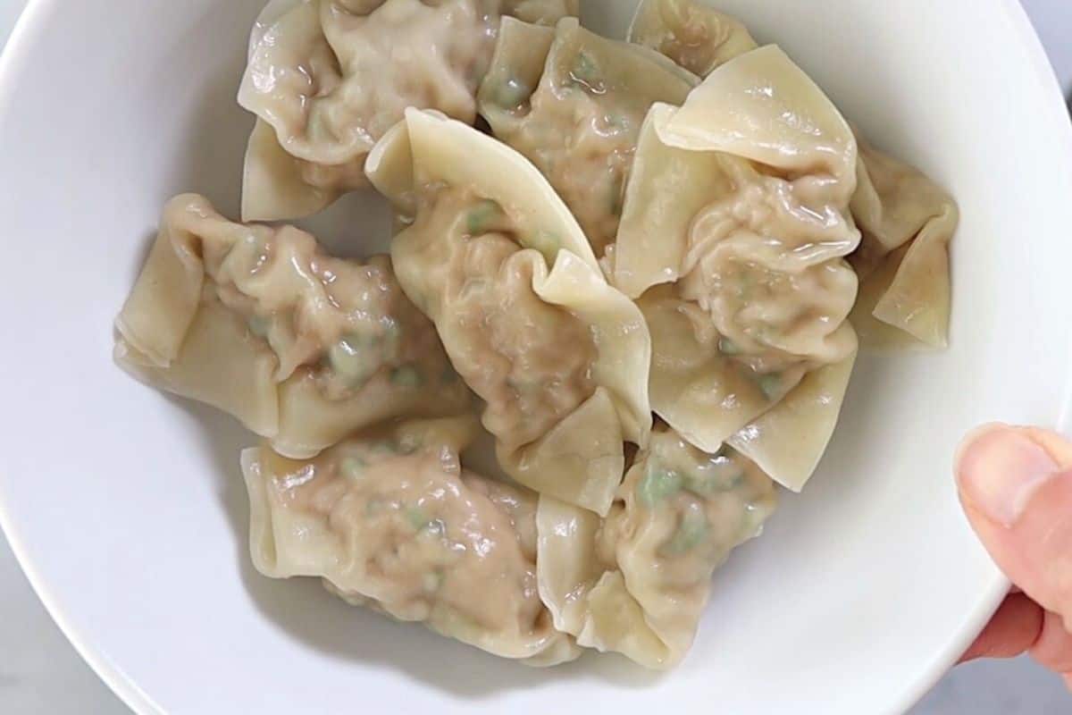 Cooked wontons in a bowl.