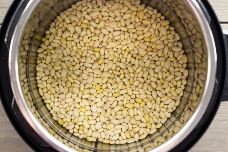 Dried Peruvian beans in an Instant Pot filled with water