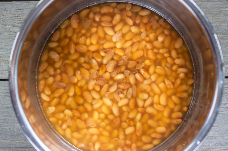 Cooked Peruvian beans in the instant pot with cooking liquid.