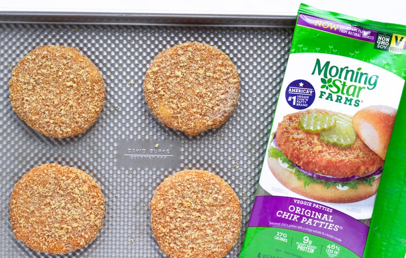 Chik Patties on a baking sheet with package of product next to it.