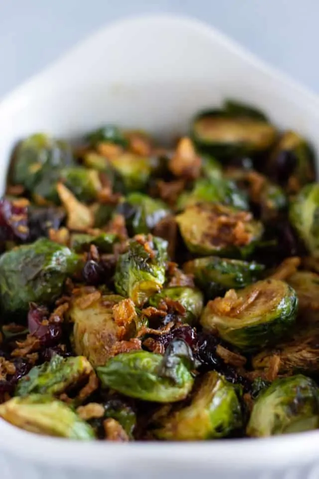 Roasted Brussel Sprouts in a white serving dish