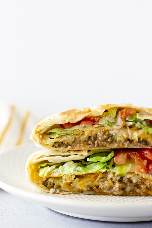 Crunchwraps cut in half and stacked on top of each other,