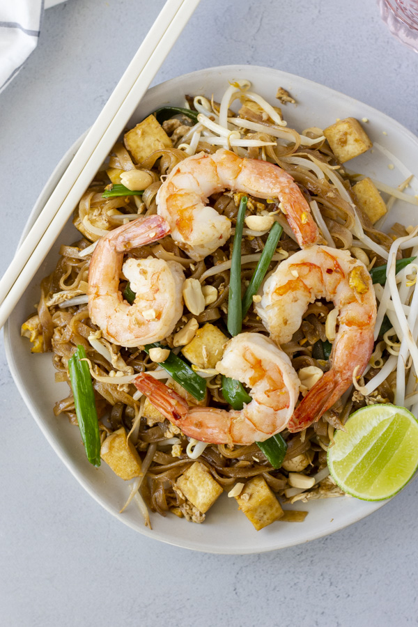 Overhead view of Pad Thai with chopsticks on the side.