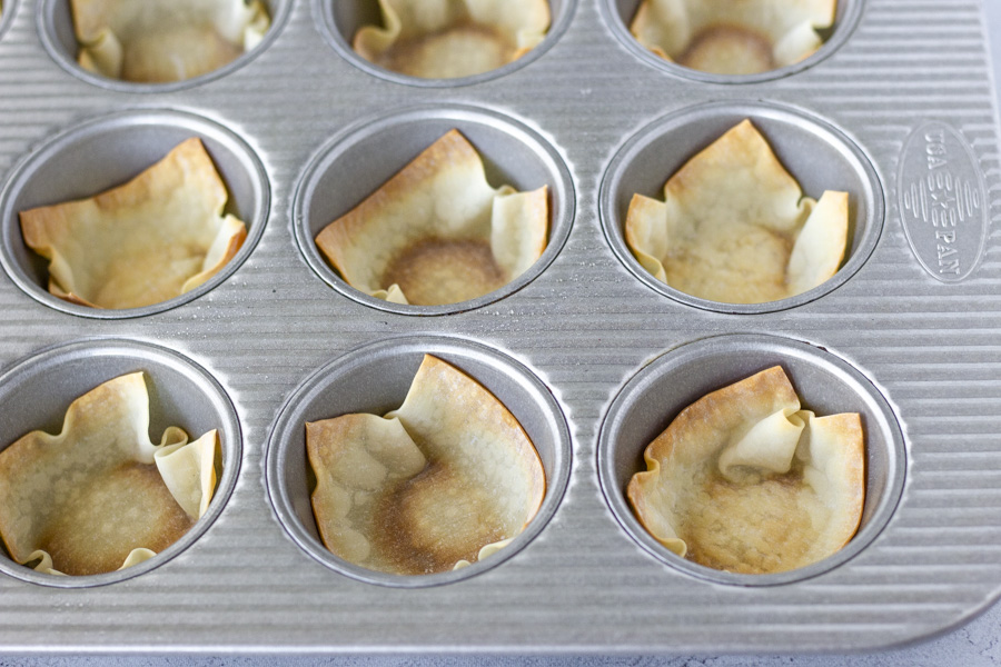 Baked wonton wrapper in muffin tin.