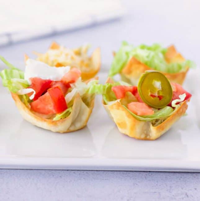 Feature image of taco wonton cups on a plate.