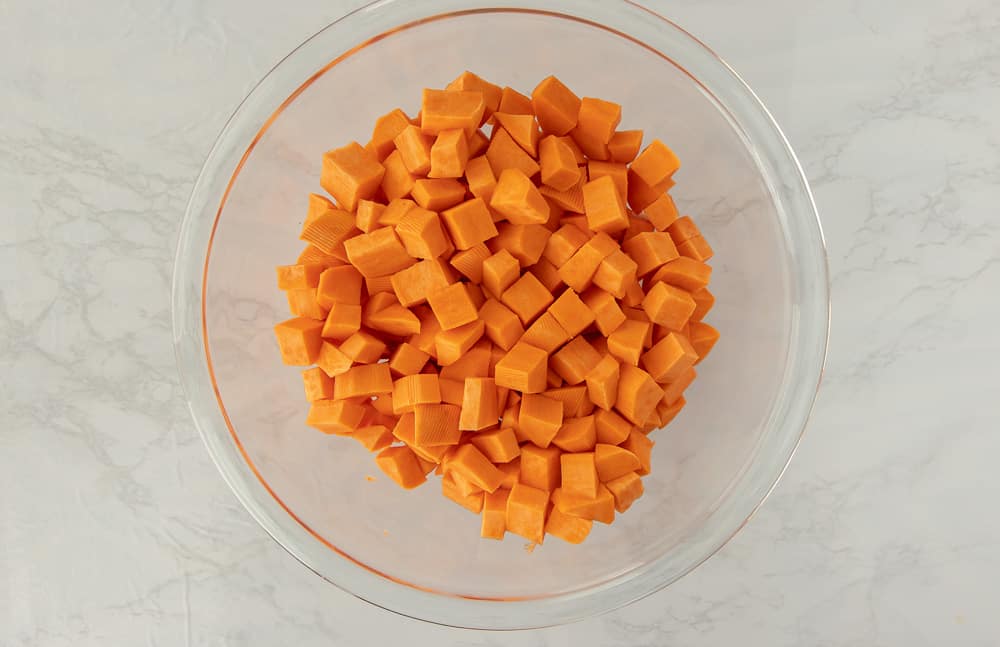 Glass bowl of diced sweet potatoes