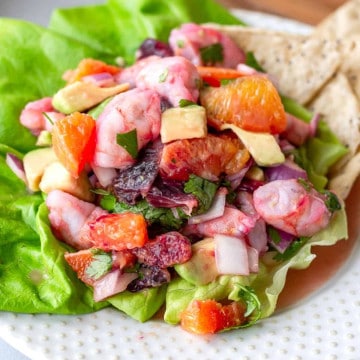 Citrus Shrimp Ceviche on a plate with a bed of lettuce.