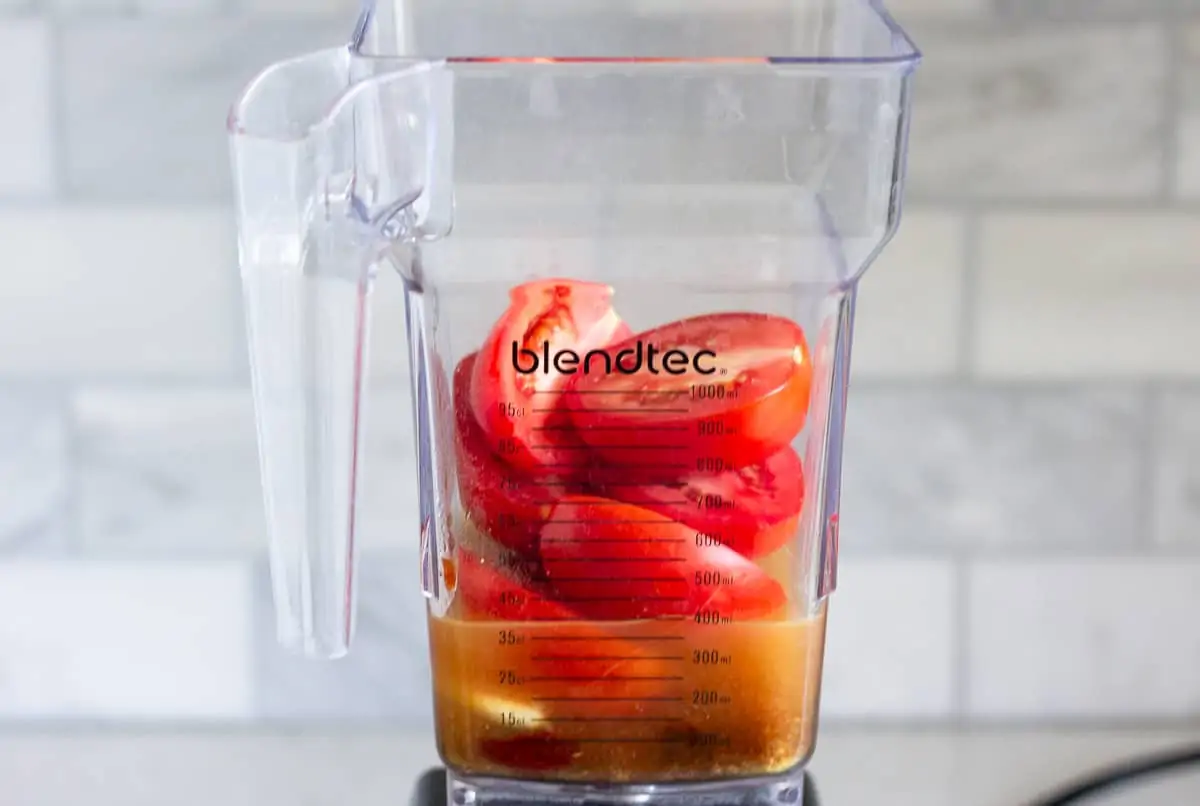 Tomatoes and broth in a blender