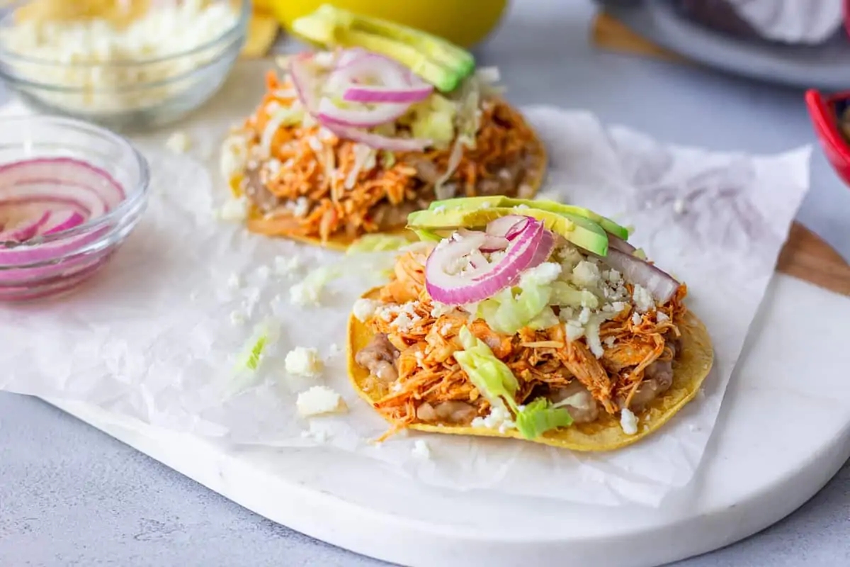 Two Tostadas on parchment paper