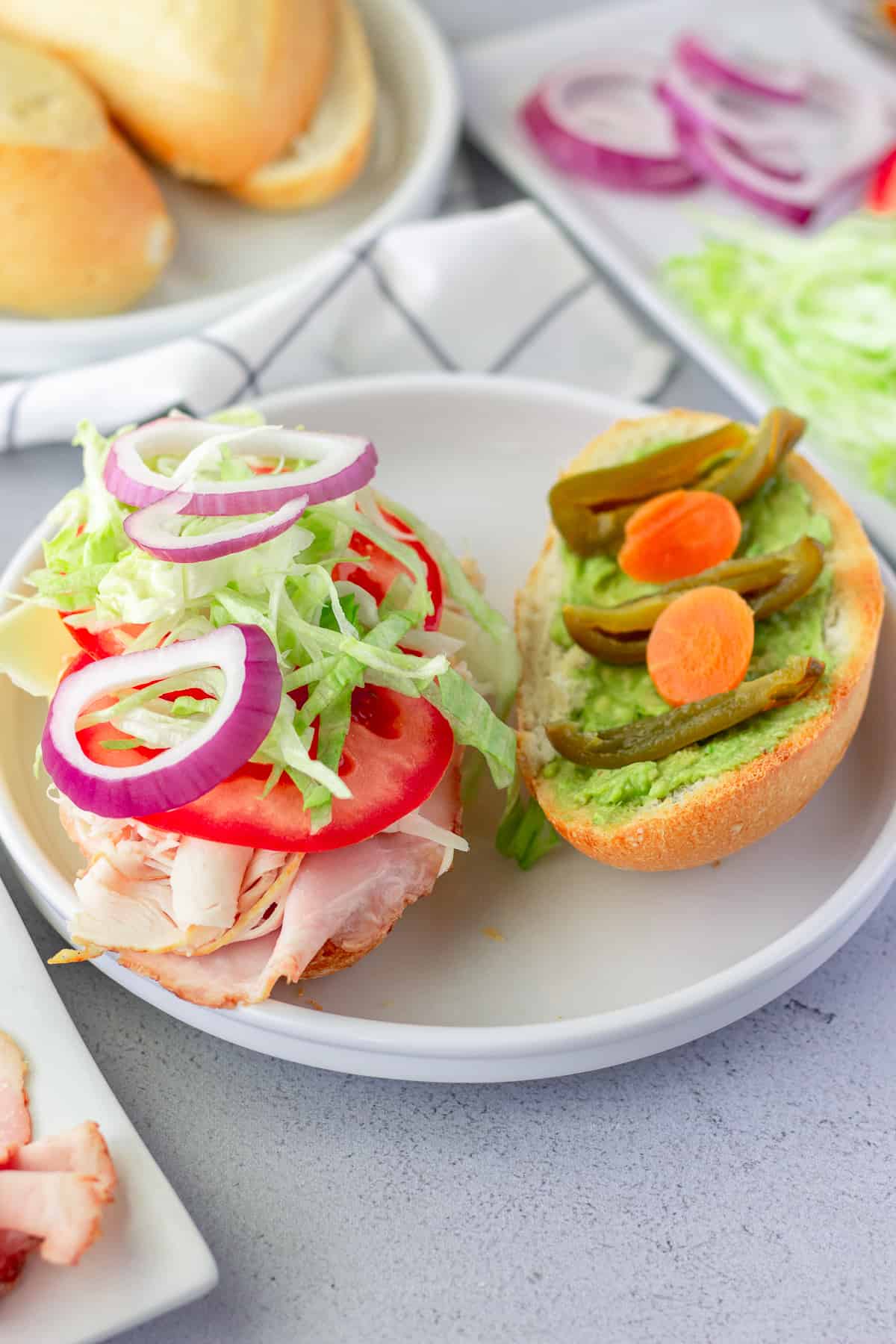 Open faced lonche to show ingredients inside the sandwich.