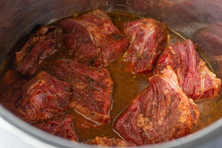 Uncooked chuck roast in the instant pot.