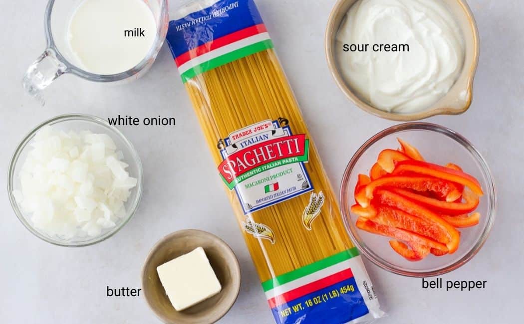 Ingredients in individual bowls, and a package of spaghetti noodles.