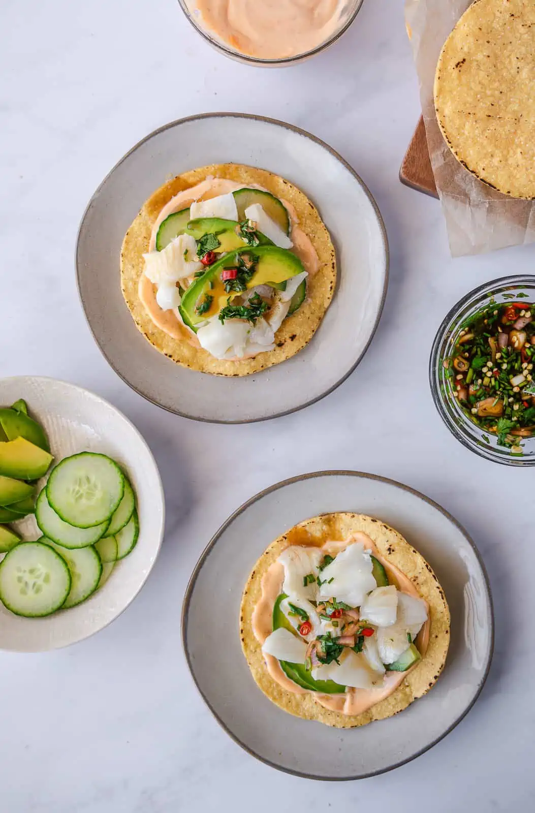 Overhead view of 2 sea bass ceviche tostadas.