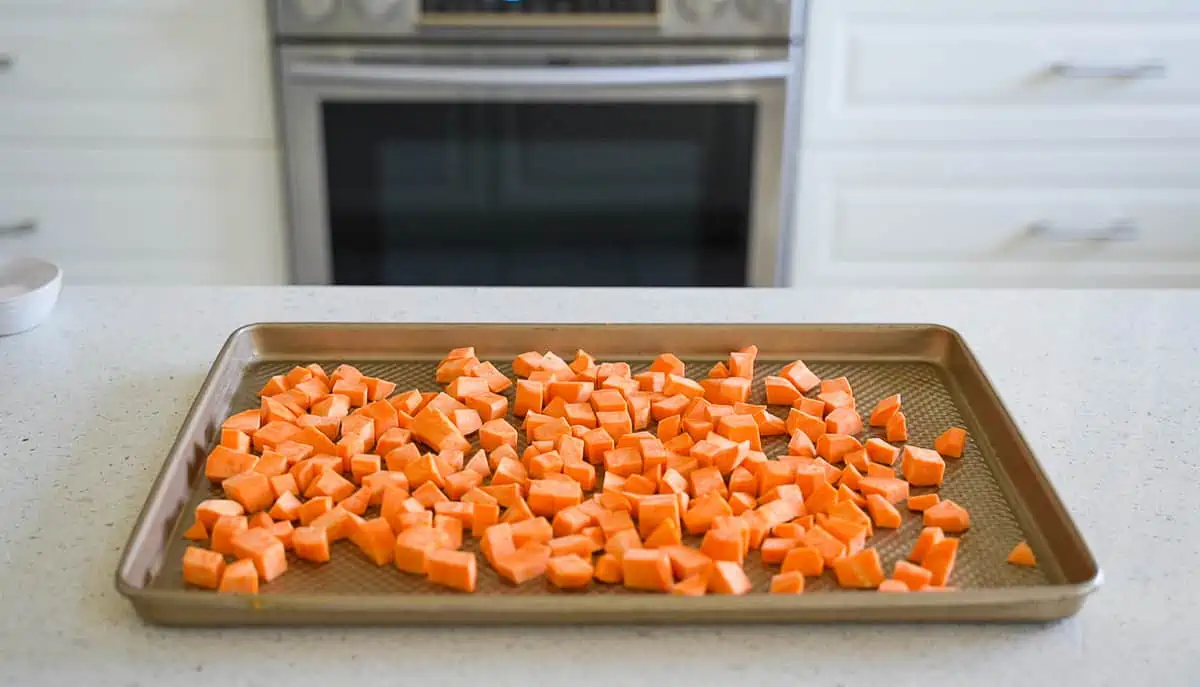 Diced potatoes on a baking sheet.