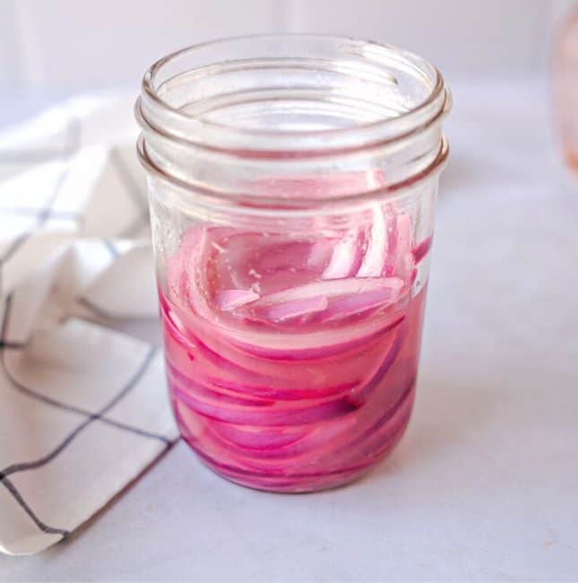 Feature image of lime pickled red onions.