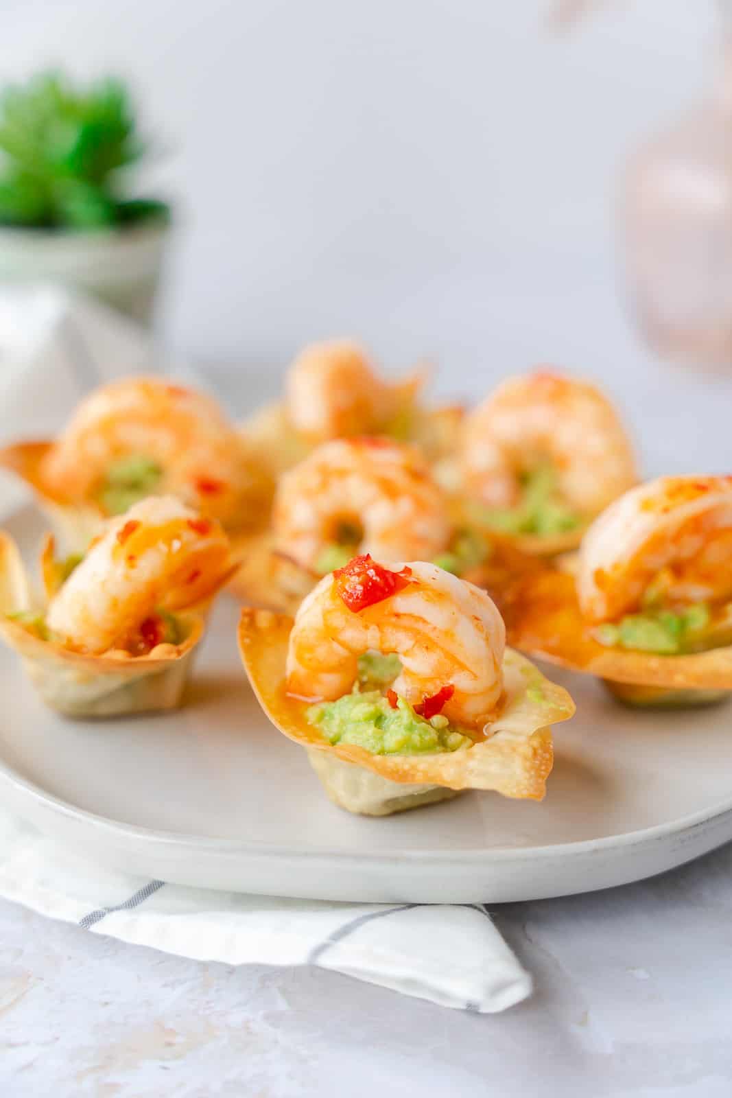 Shrimp and Guacamole cups on a plate.