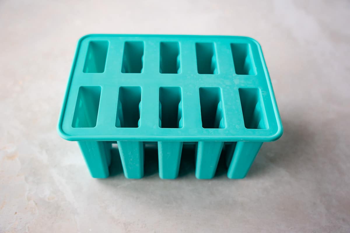 Teal colored popsicle mold.