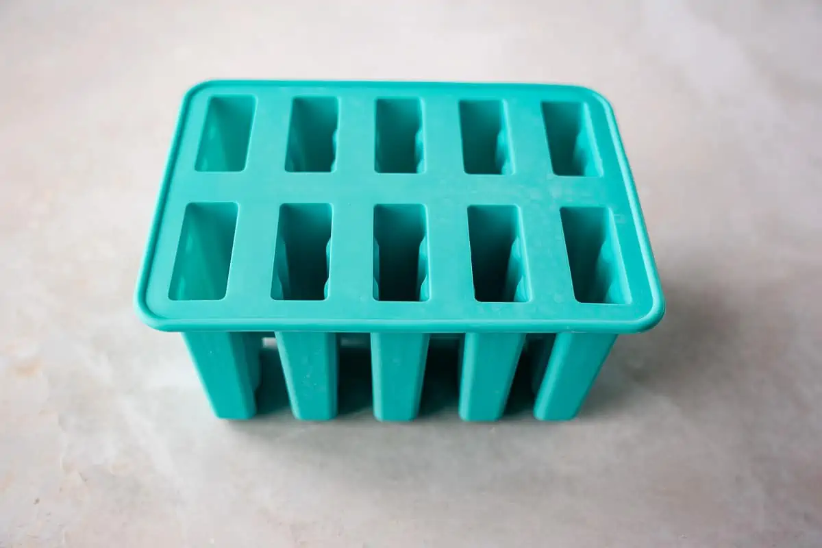 Teal colored popsicle mold.