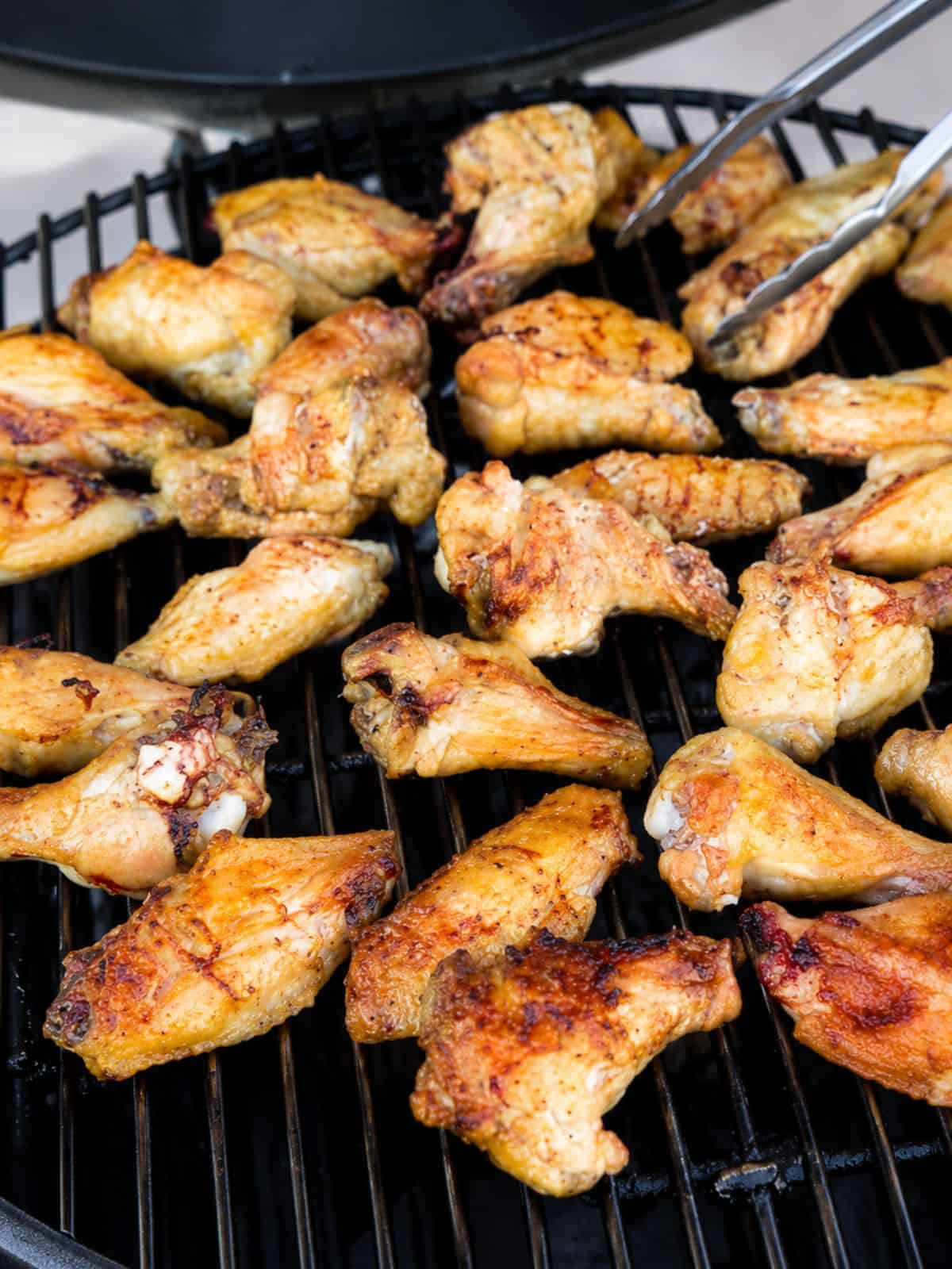 Chicken wings on a griller.