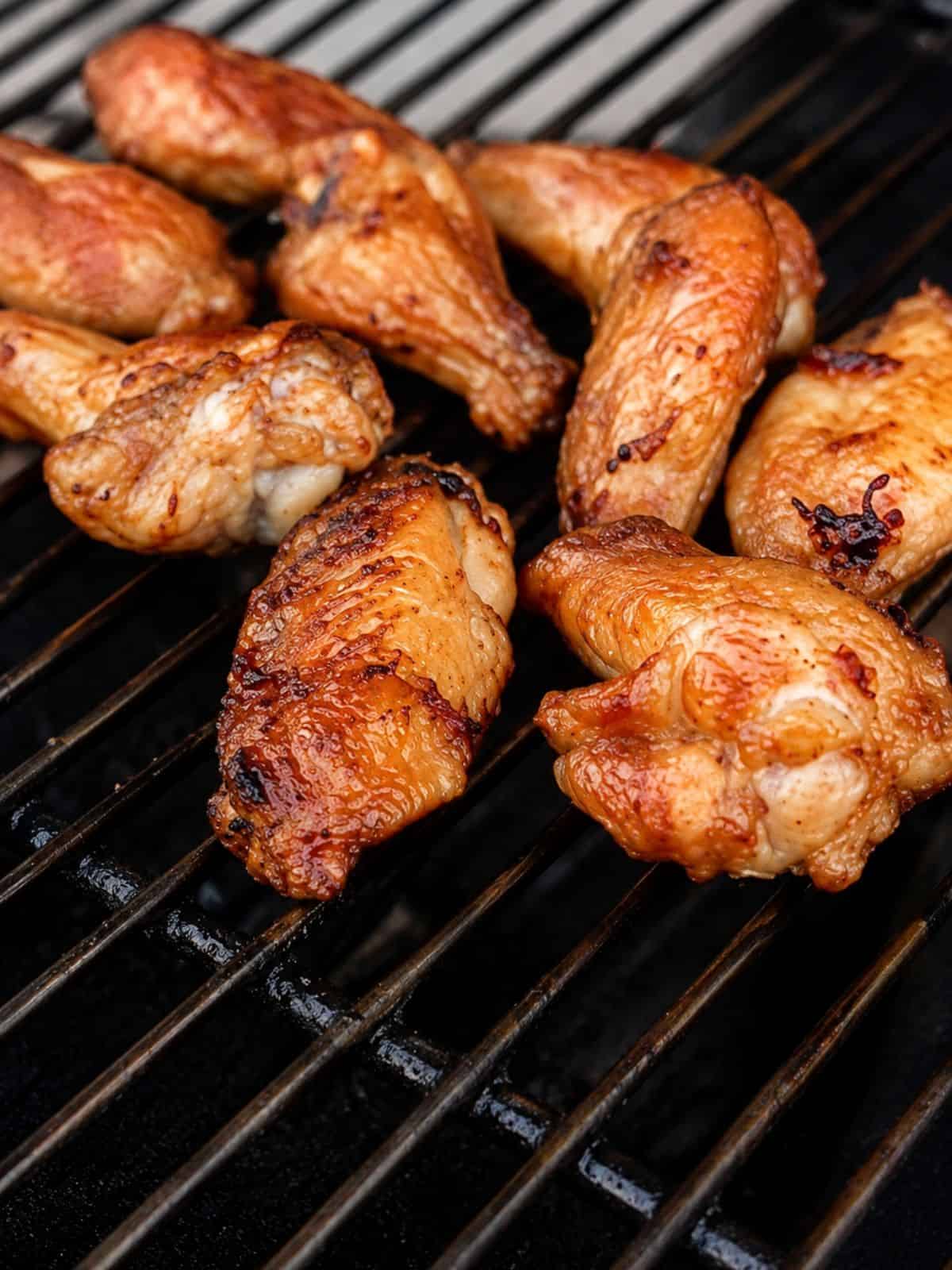 Chicken wings on a griller.