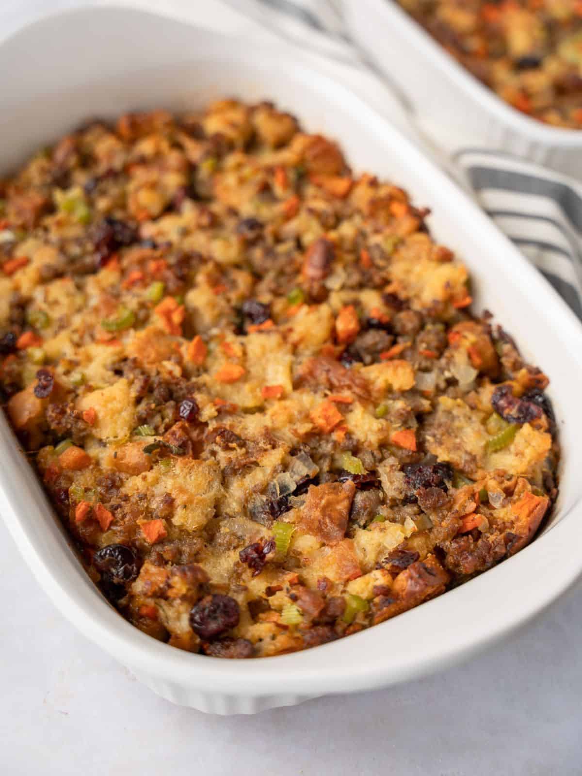 Stuffing in a large white casserole dish.