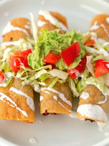 Feature image of taquitos with toppings.