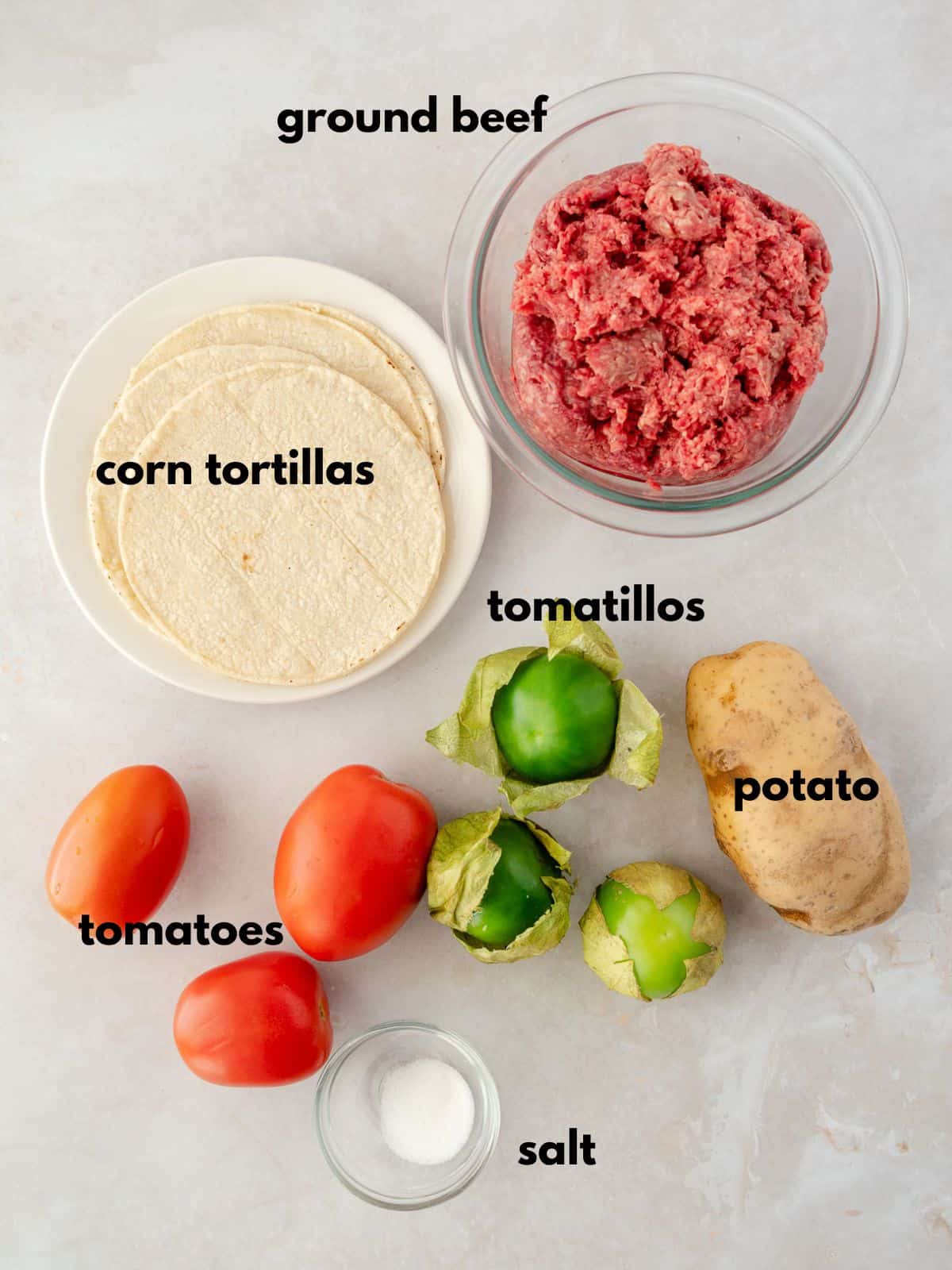 Ingredients with text labels for picadillo mixture.