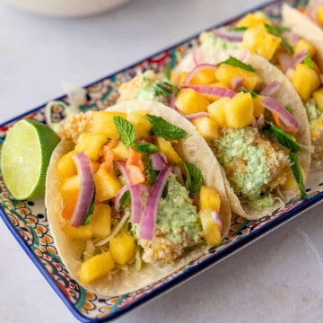 Feature image of crispy baked tacos with pineapple salsa.