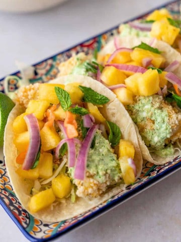 Feature image of crispy baked tacos with pineapple salsa.