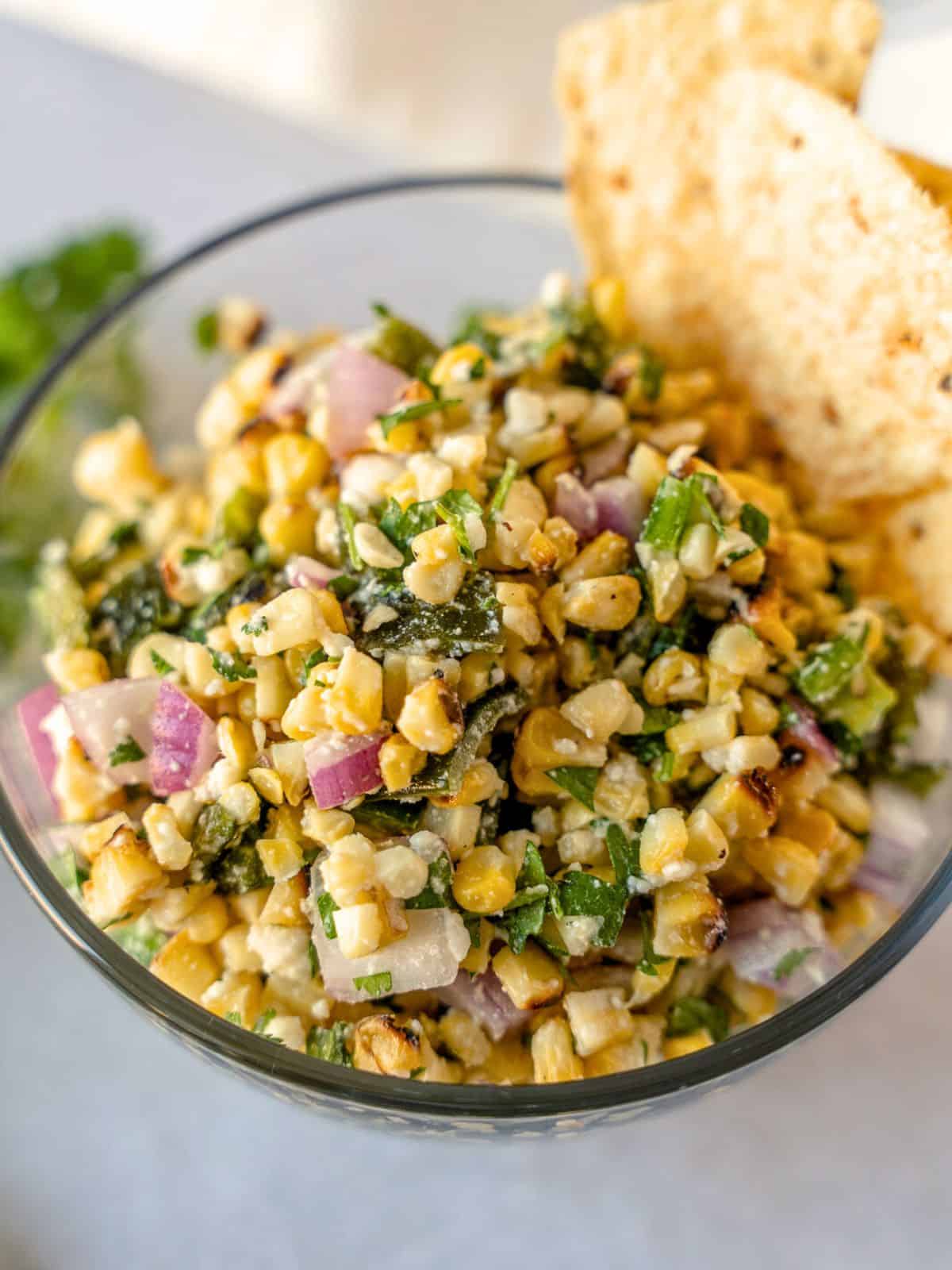 Roasted chili corn salsa in a glass bowl.