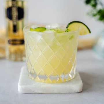 Up close shot of ginger blossom margarita in a clear glass.