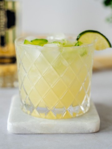 Up close shot of ginger blossom margarita in a clear glass.