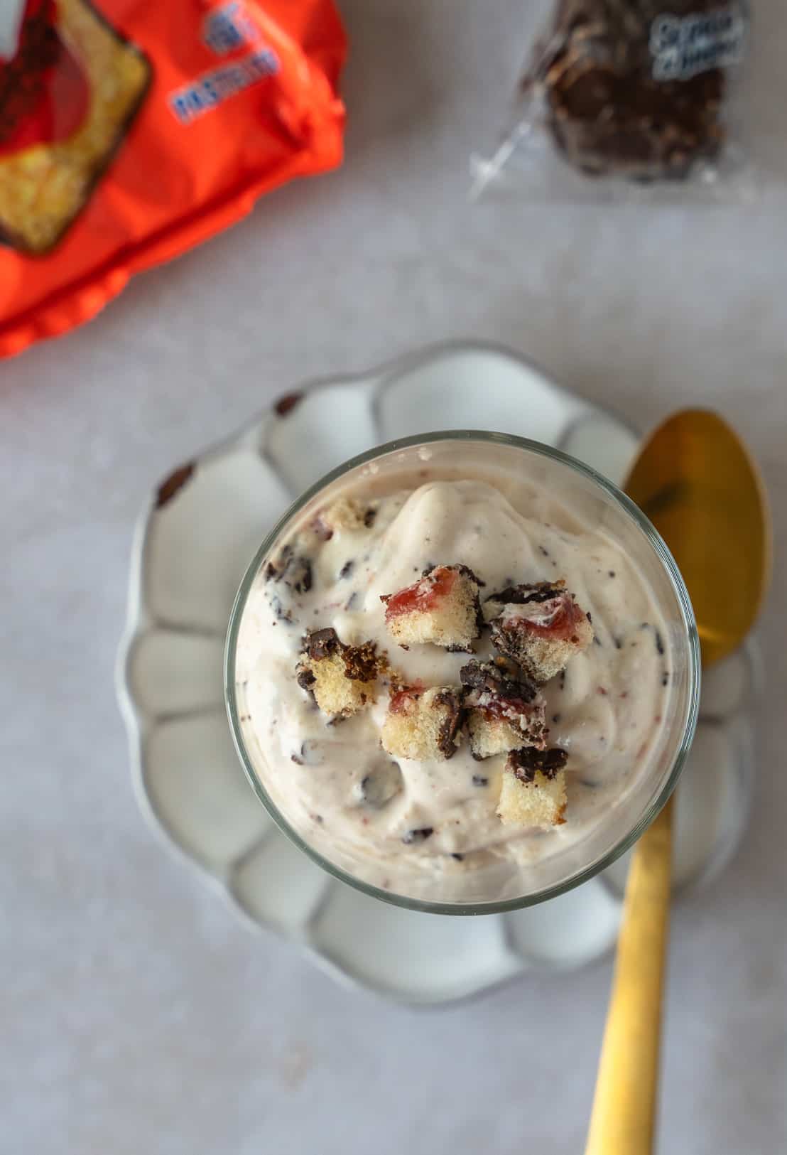 Overhead view of ice cream with crumbled gansito pieces on top.