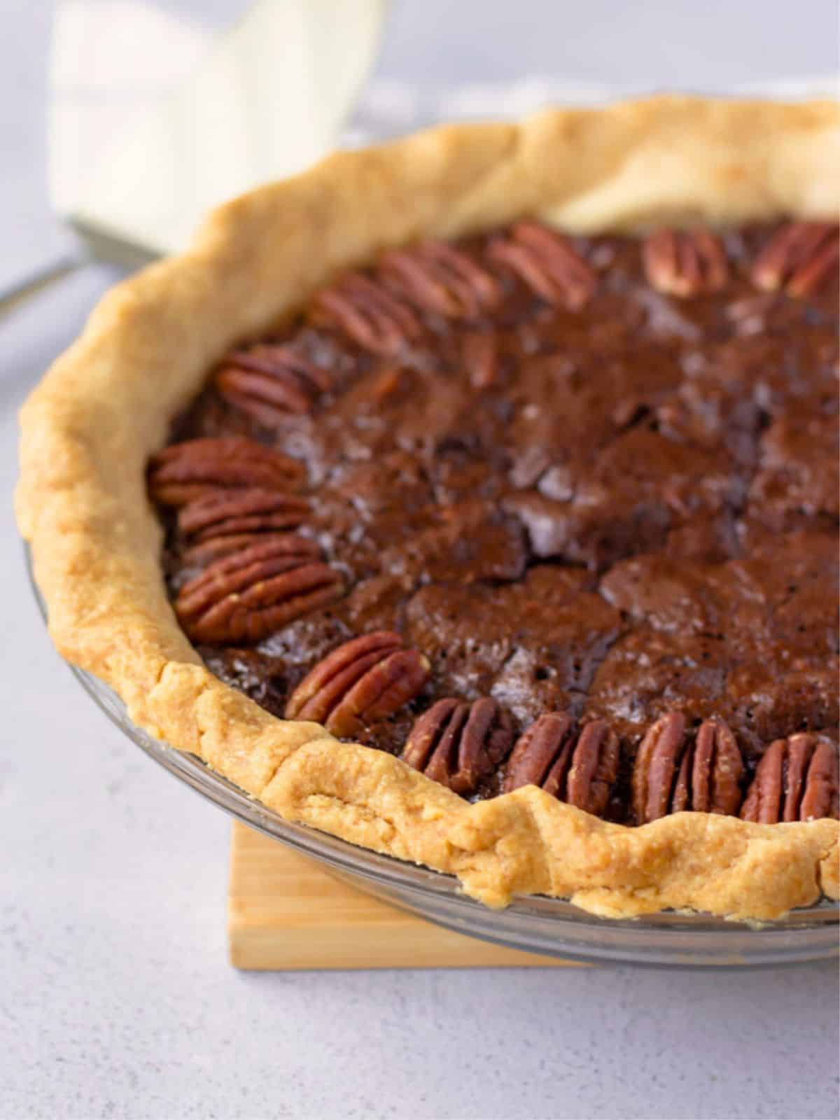 A whole baked chocolate pecan pie.