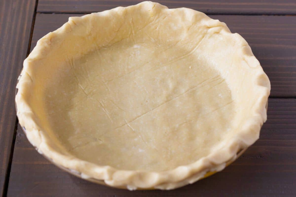 Unbaked pie crust in a dish.