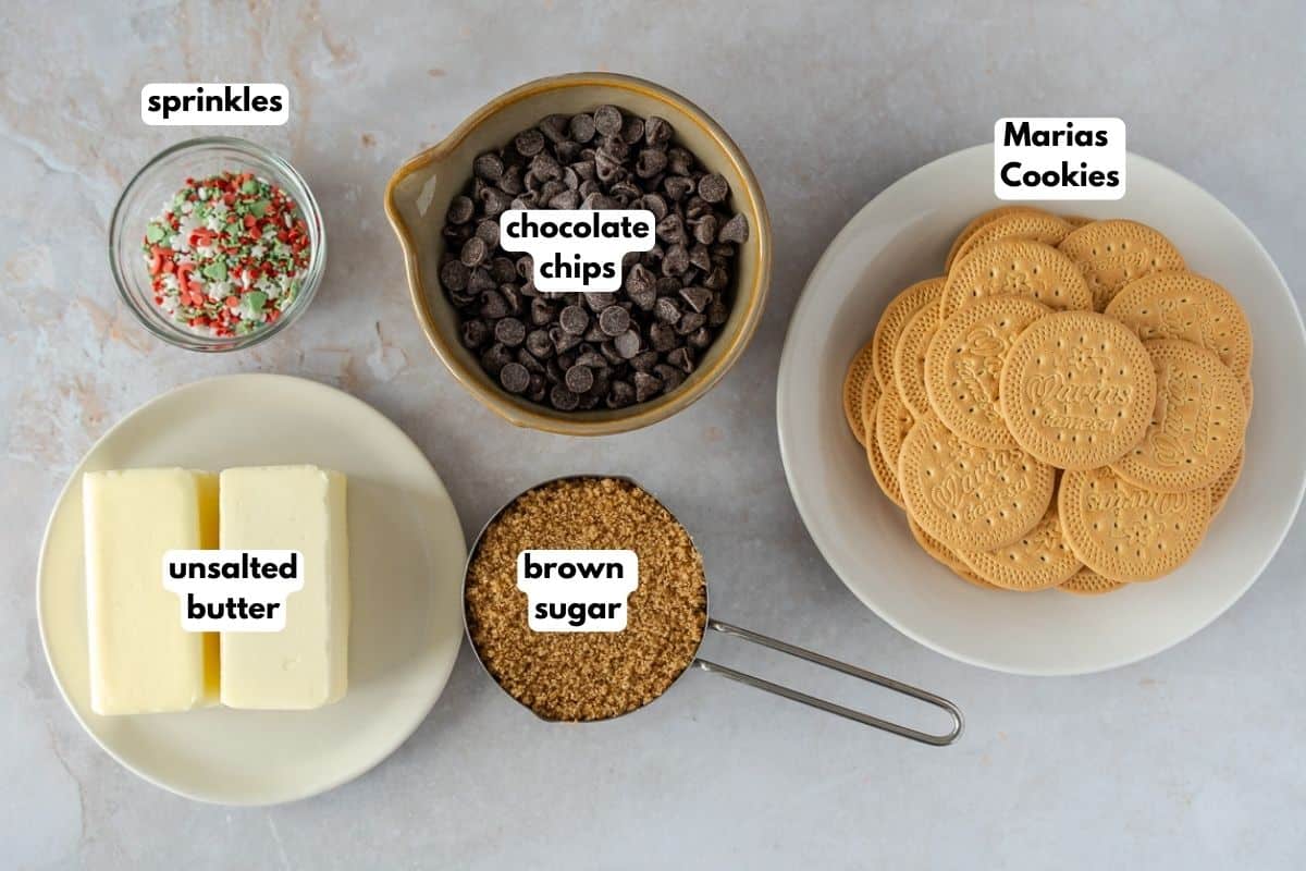 Ingredients with text, sprinkles, chocolate chips, Marias cookies, unsalted butter, and brown sugar.