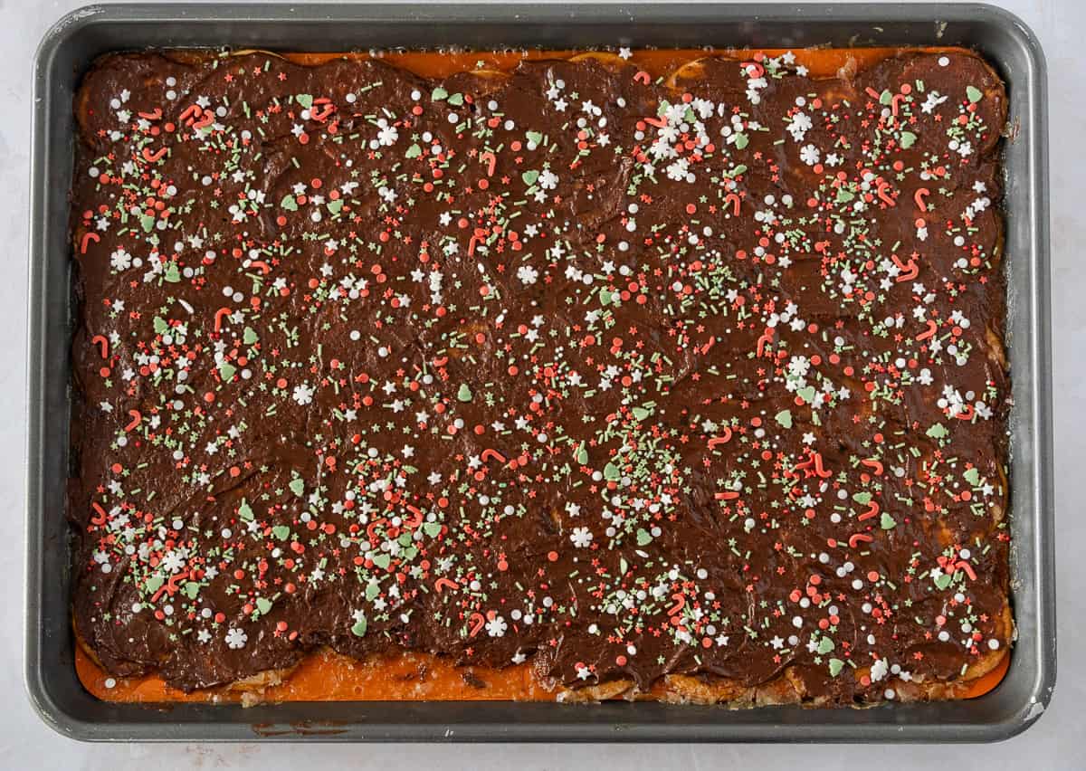 Cookie sheet with toffee and sprinkles on top.