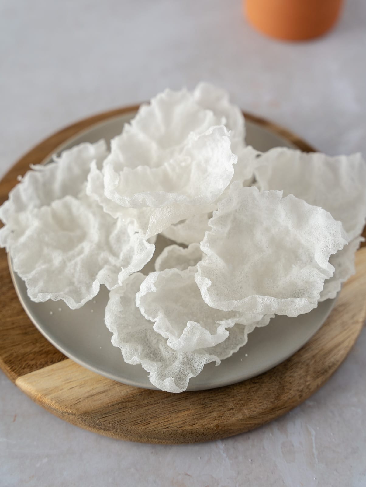 Crispy rice paper chips on a plate.