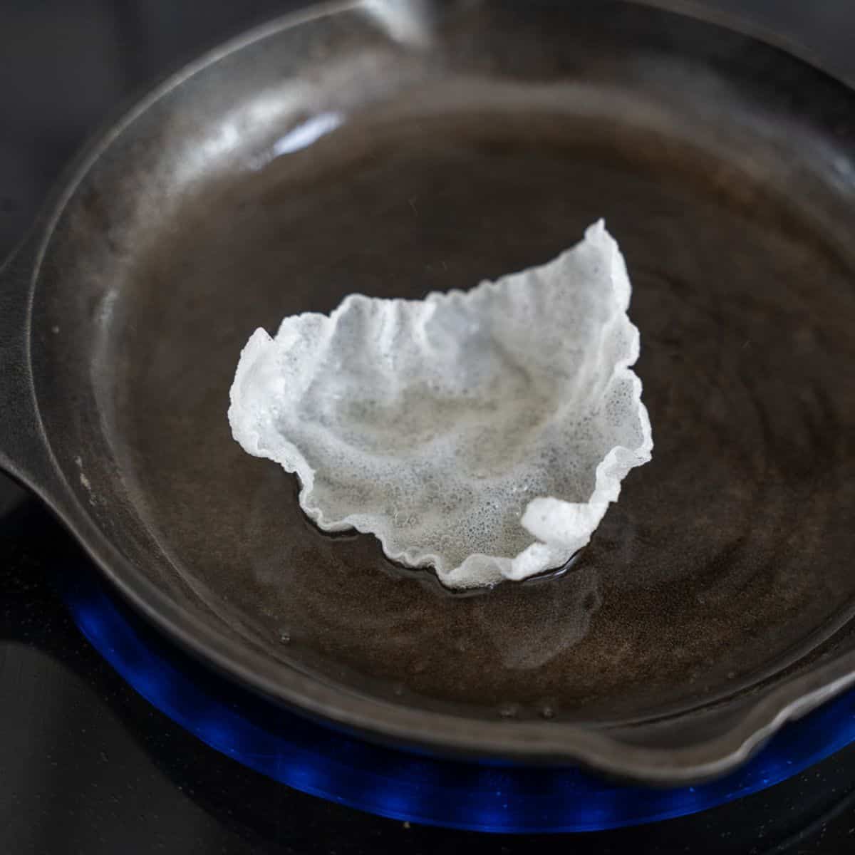 Cooked rice paper chip in oil.