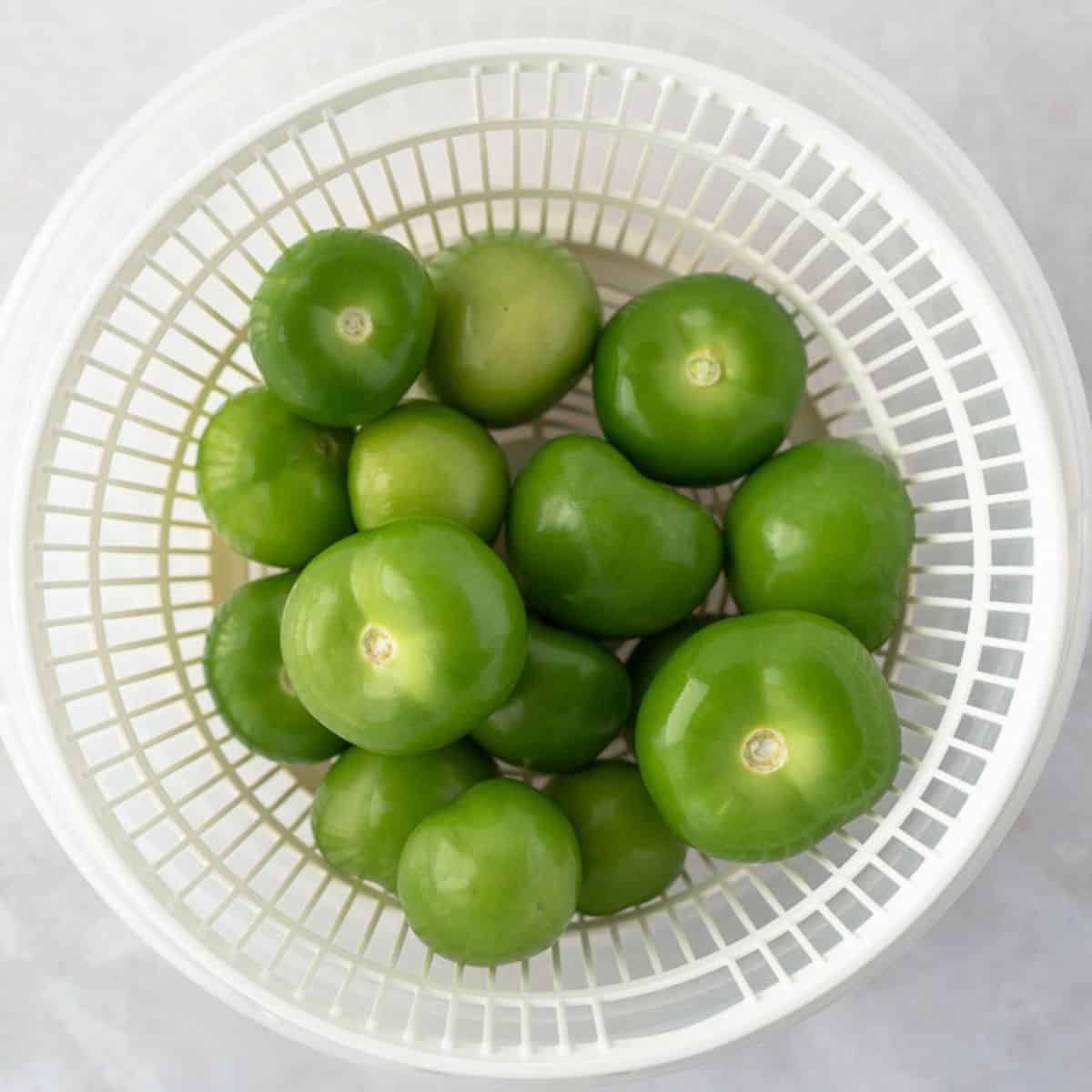 Raw tomatillos in a basket.