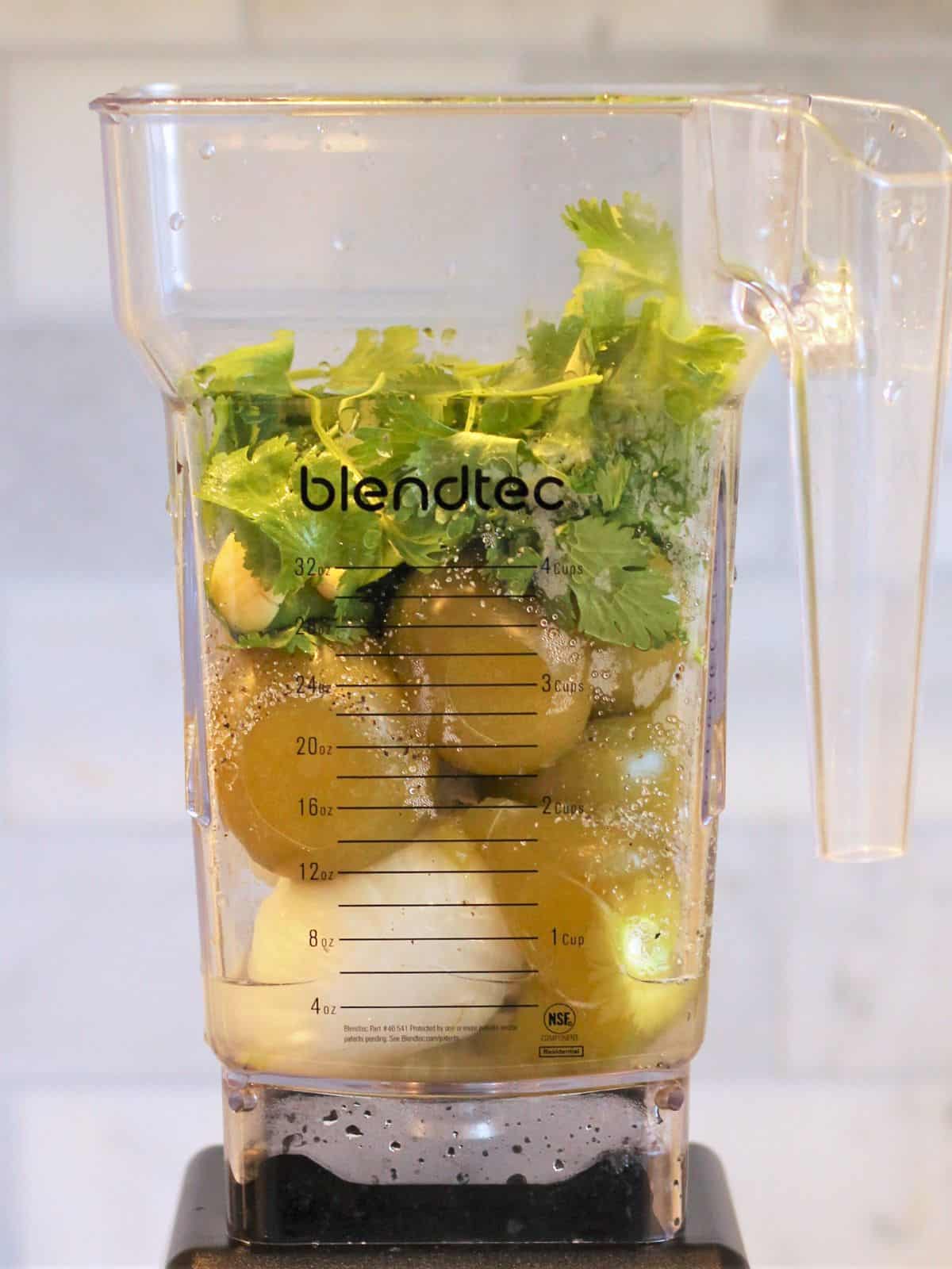 Ingredients for salsa verde in a blender.