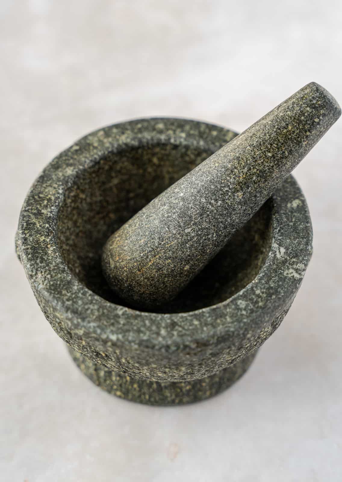 A granite mortar an pestle or molcajete in Spanish.