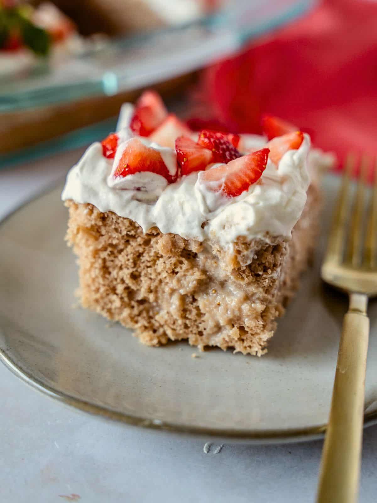 Up close view of a slice of strawberry tres leches.