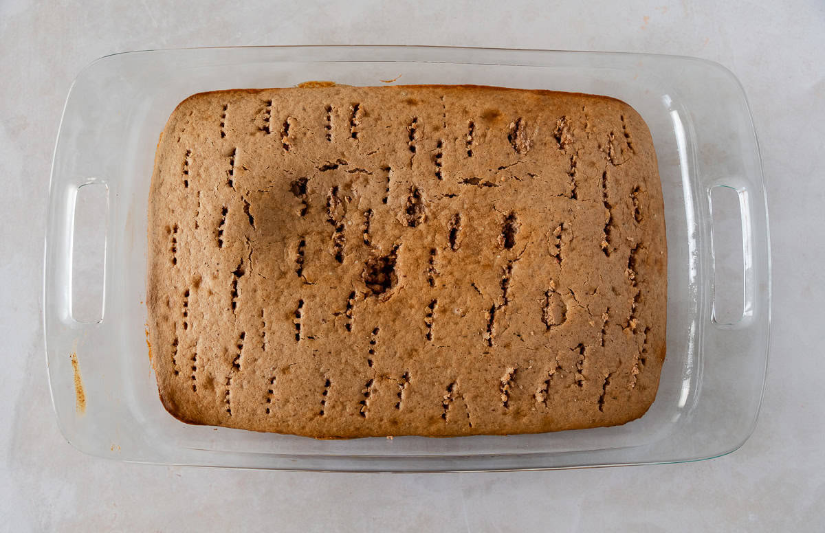 Baked cake with holes from a fork.