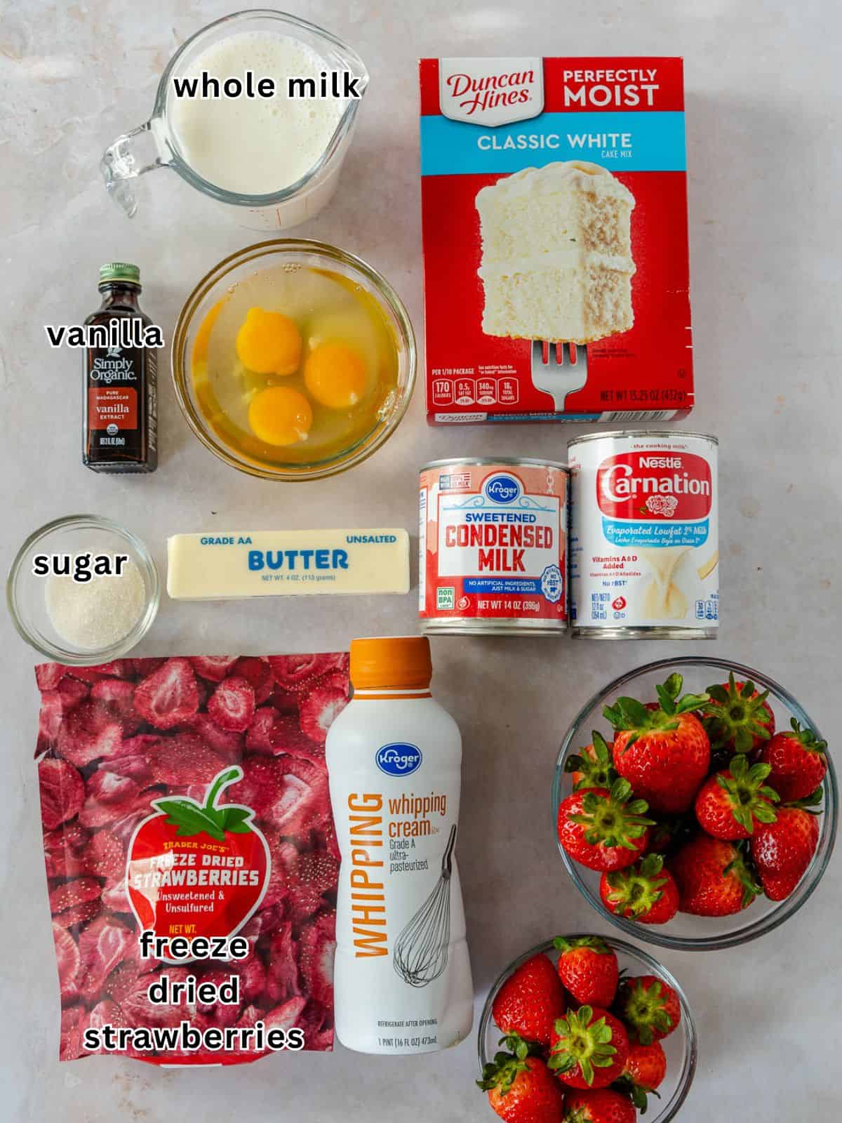 Ingredients with text for strawberry tres leches cake.