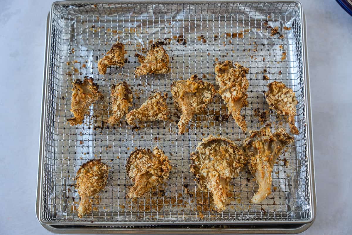 Breaded Mushrooms on a baking sheet. 