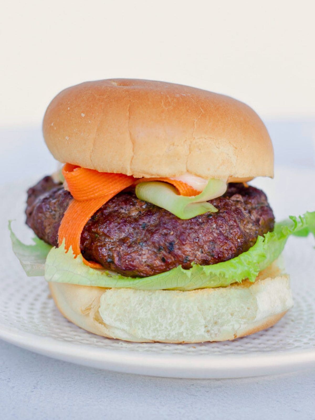 A hamburger on a plate.
