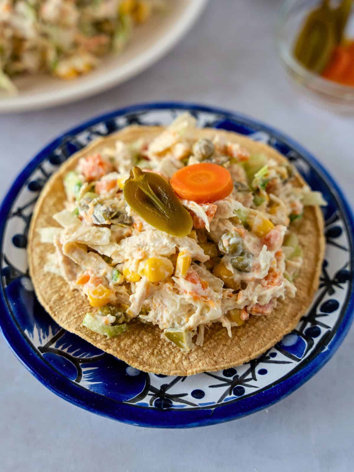 Mexican chicken salad on a tostada.